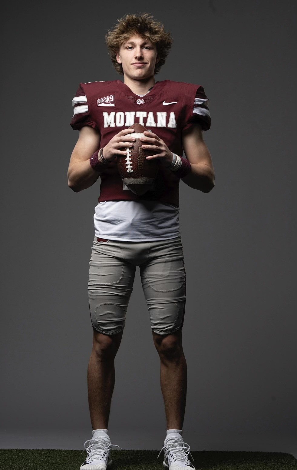 Mavericks quarterback Brady Jay taking a photo in the Grizzlies uniform on a visit to the school. Jay said he grew close with the staff there, and it began to feel like home, which led to his decision to commit.