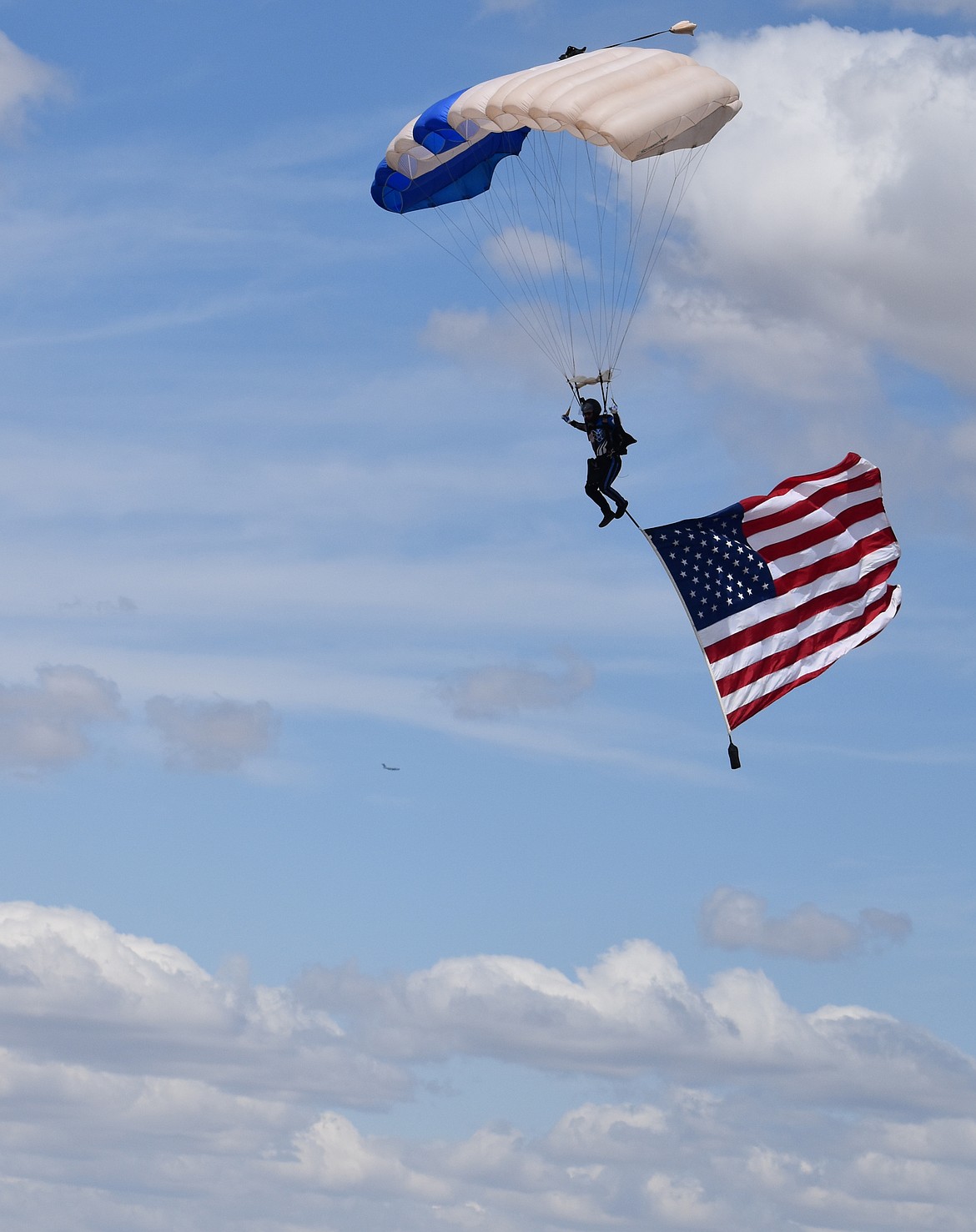 Cadet 1st Class Ace Federspiel of Yakima brings the American flag to the Moses Lake Airshow Saturday.