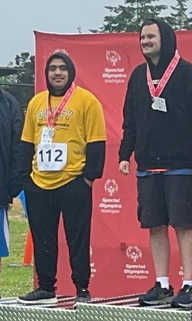 Jacks' athlete Isaac Cruz stands on the podium after earning second place in one of the events. Cruz earned silver in both shotput and the 100m dash.