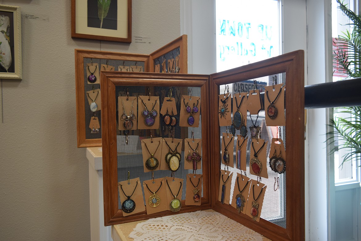 The Up Town Art Gallery has a display of jewelry people can buy along with several other art forms filling the area.
