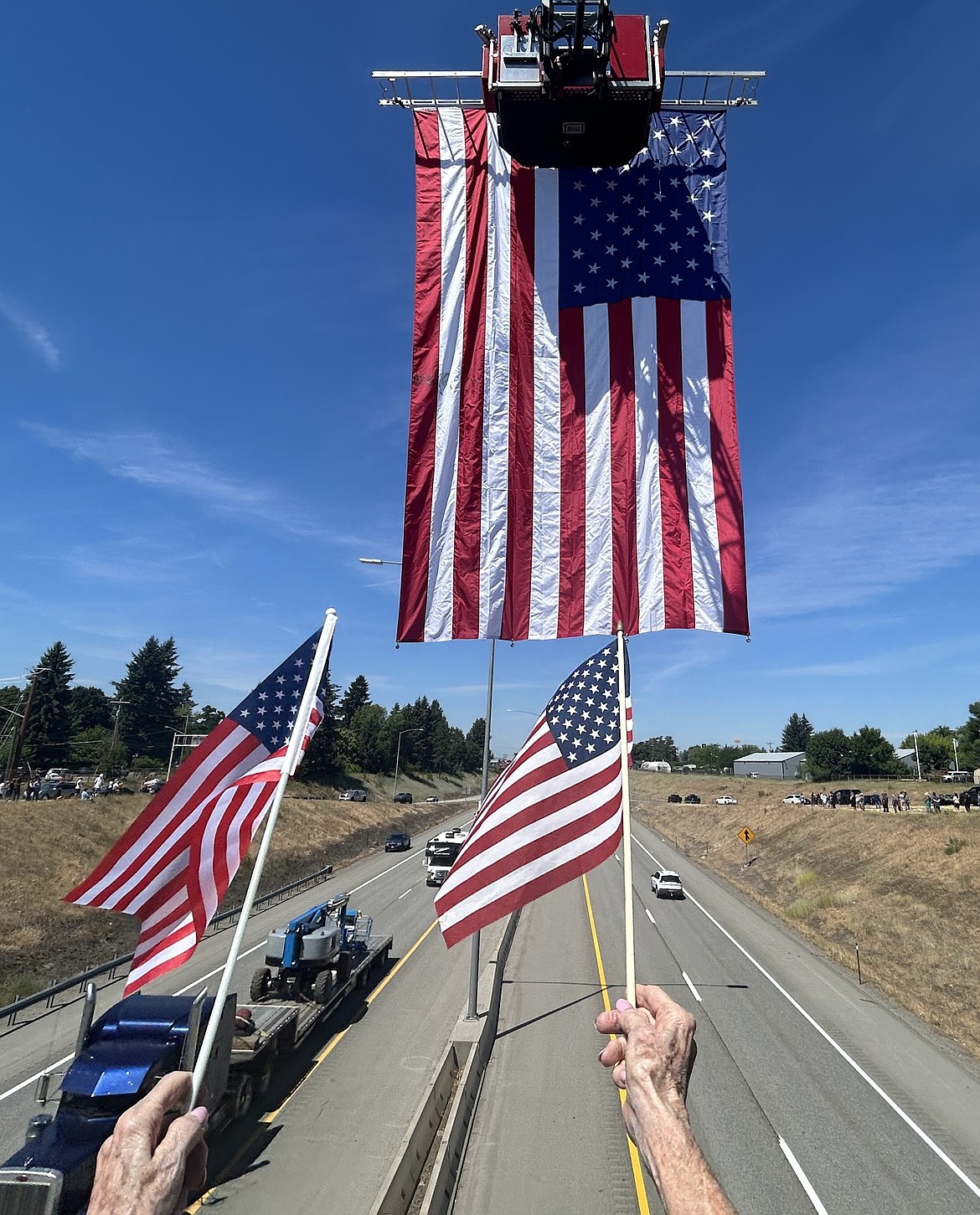 Flag fly from the Fourth Street Bridge.