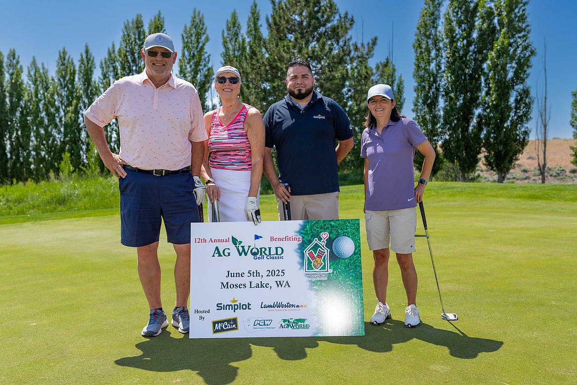 A team of golfers pose for a team photo during the AG World Golf Classic. The tournament saw 106 golfers play at the Links at Moses Pointe.