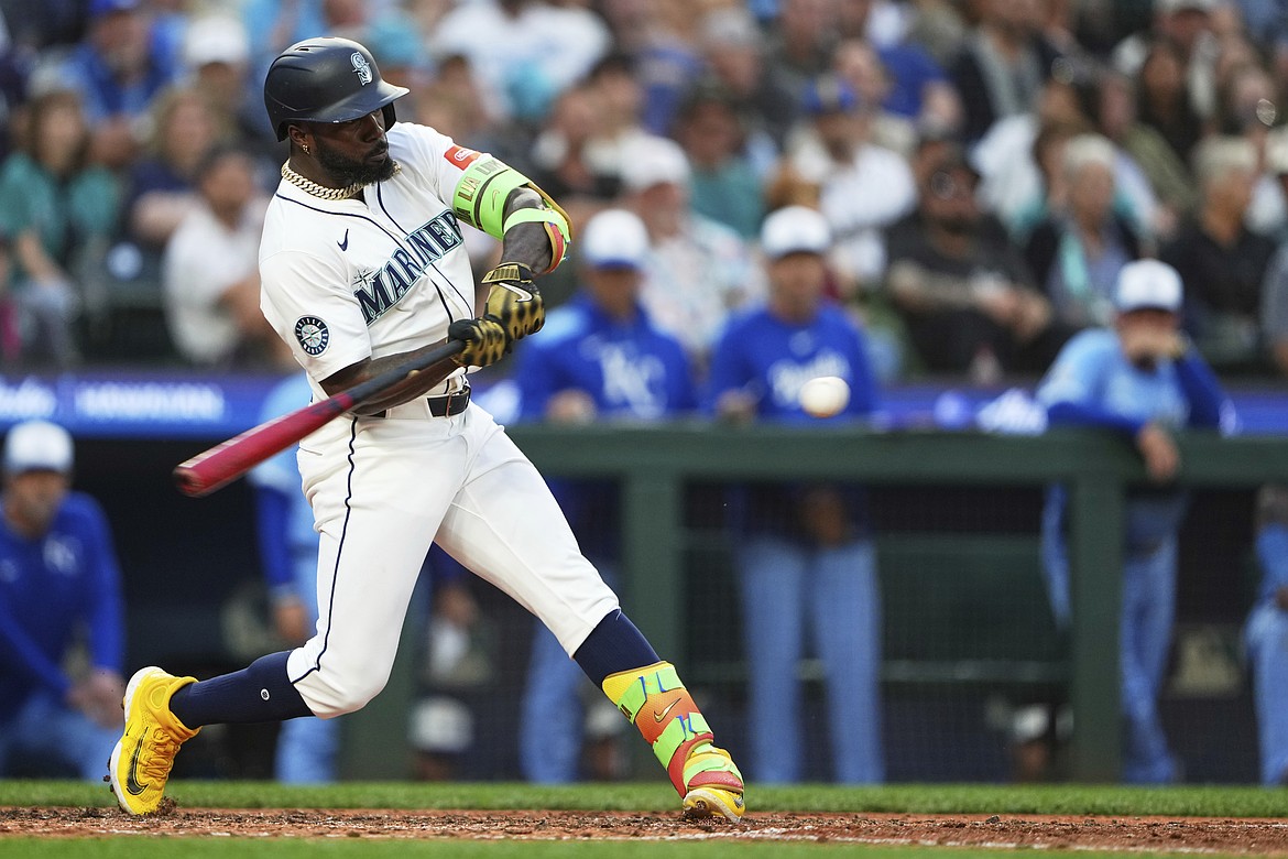 Seattle Mariners' Randy Arozarena hits a solo home run against the Kansas City Royals during the sixth inning of a baseball game Wednesday, July 2, 2025, in Seattle.