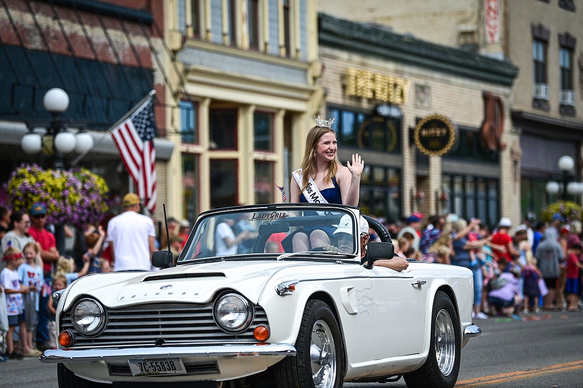 Miss Montana's Teen 2025 Marygrace Knuffke rides in a Triumph convertible in the Kalispell 4th of July Parade on Friday, July 4. (Casey Kreider/Daily Inter Lake)
