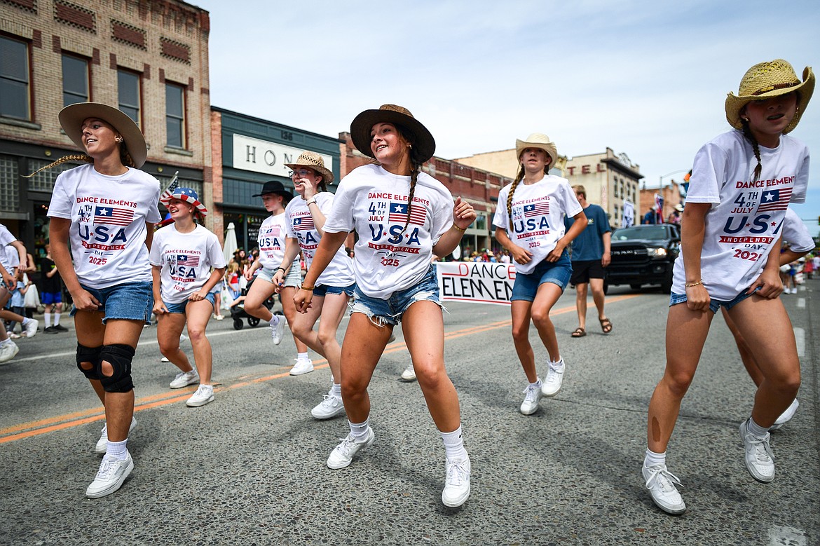 Dancers from Dance Elements make their way down Main Street in the Kalispell 4th of July Parade on Friday, July 4. (Casey Kreider/Daily Inter Lake)