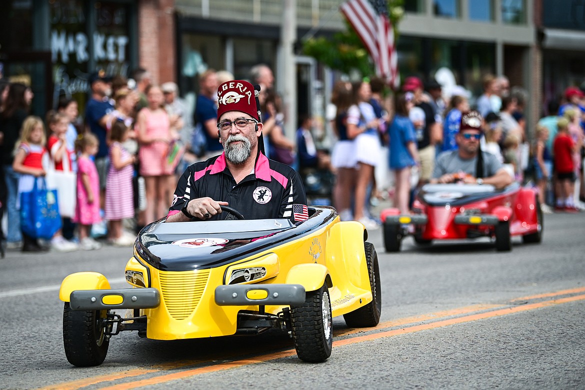Members of the Flathead Shrine Club drive down Main Street in the Kalispell 4th of July Parade on Friday, July 4. (Casey Kreider/Daily Inter Lake)