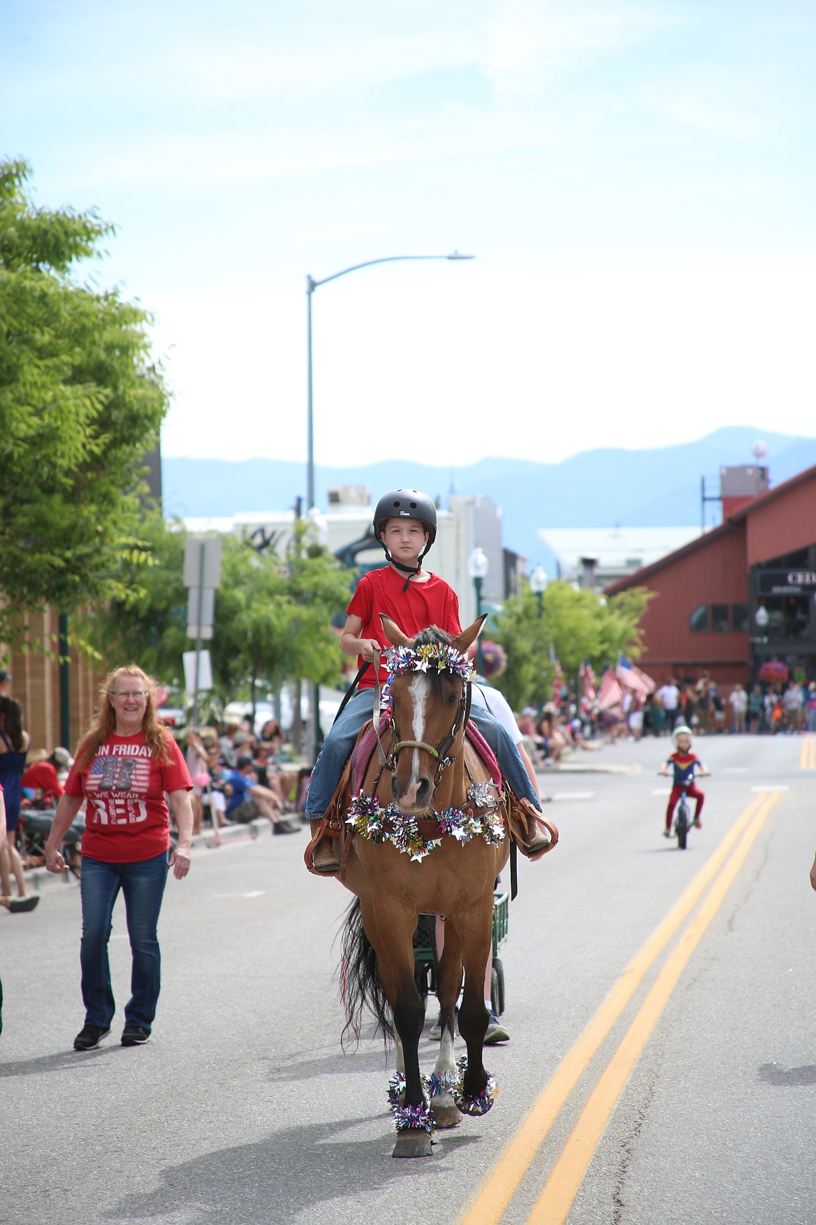 A local youth rides his horse during the Sandpoint Lions Fourth of July kids parade.