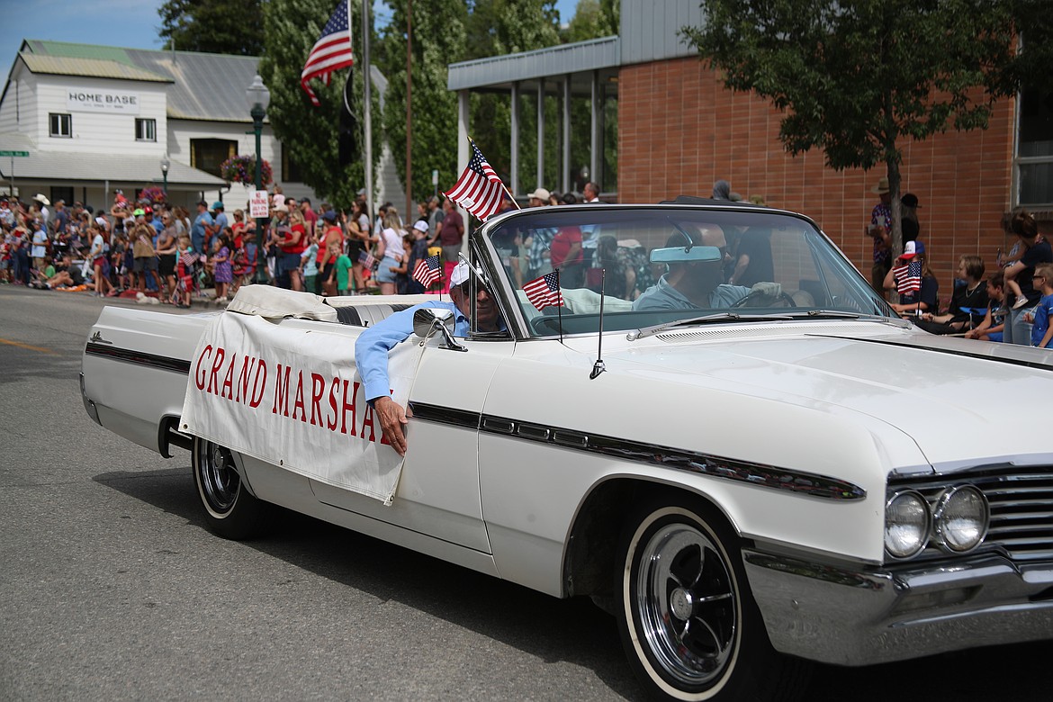 Fourth of July grand marshal Dale Coffelt gets a list from grandson Dale McCall during the Sandpoint Lions grand parade on Friday.