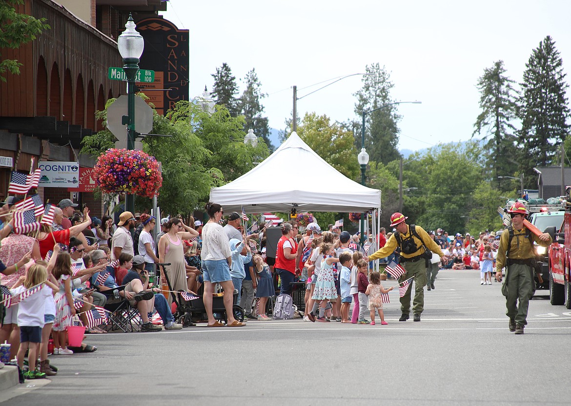 Idaho Department of Lands firefighters walk down First Avenue during Friday's Fourth of July grand parade.