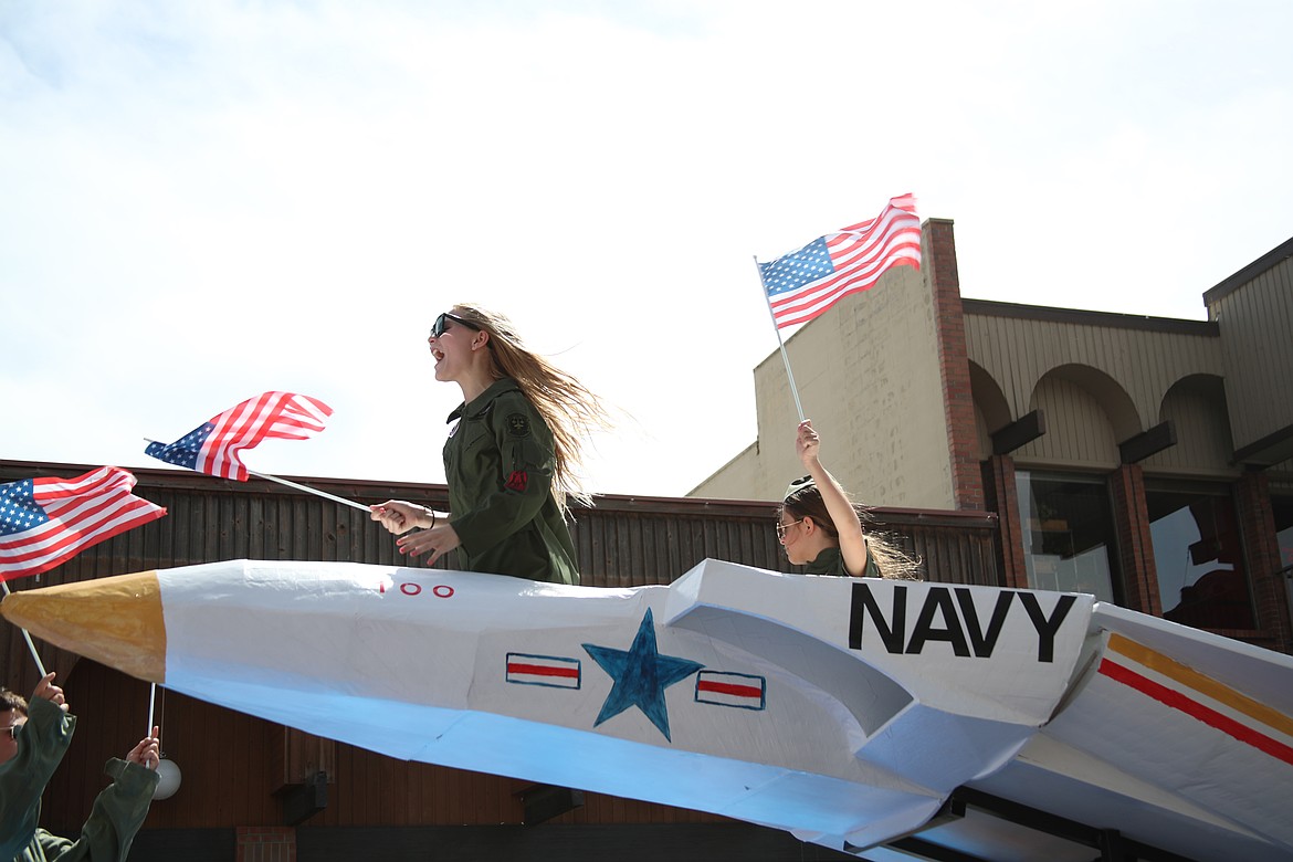 Parade participants have fun as they sit in a float celebrating the U.S. Navy. The float was one of more than 100 entries in the Sandpoint Lions grand parade, held to celebrate the Fourth of July.