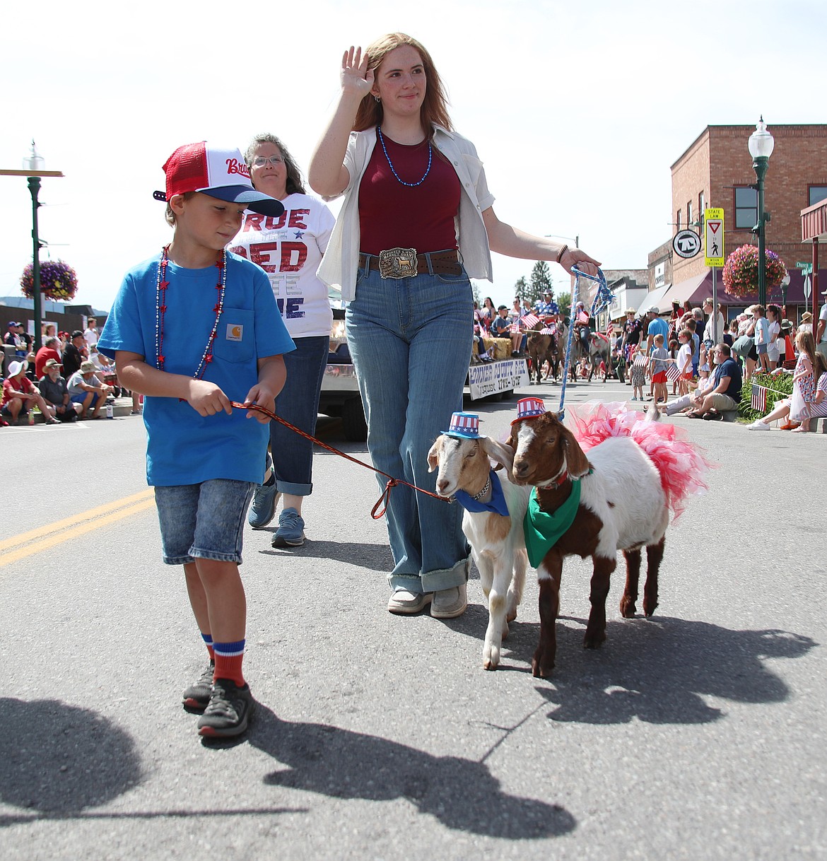 Local parade participants make their way down First Avenue during Friday grand parade, one of several events held to celebrate the Fourth of July.