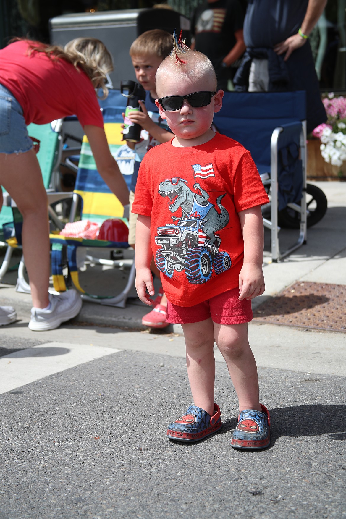 A young parade-goer shows off his Fourth of July style as he watches the Sandpoint Lions grand parade.
