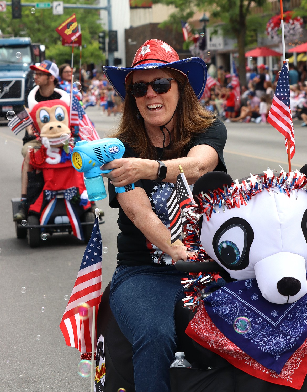 Julie Wyborny with Tour CDA rides and aims during the parade.