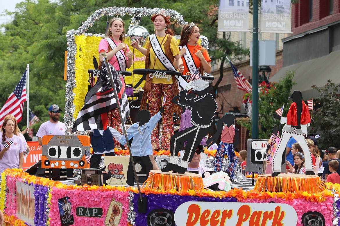 The Deer Park float rolls down Sherman Avenue. On the float are Abby Castle, Elizabeth Hamilton and Hailey Billesbach.