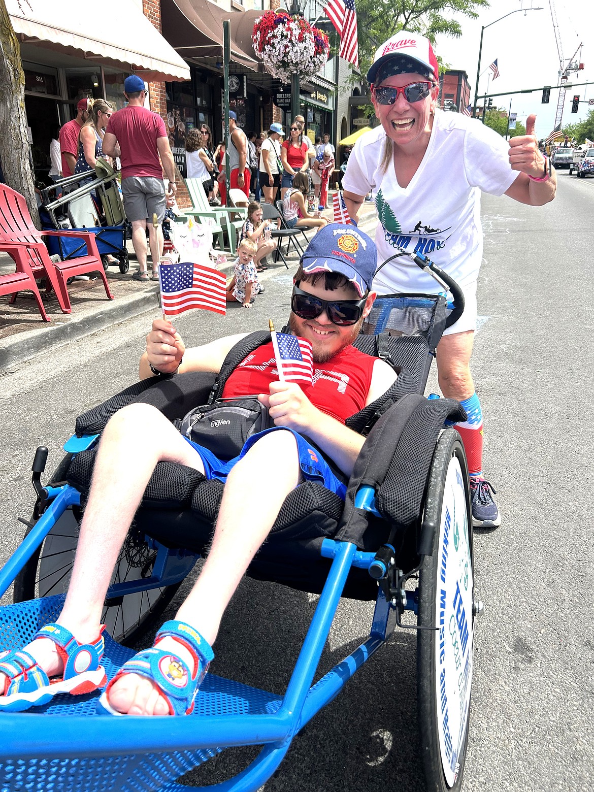 Dani Evans and Justin with Team Hoyt race near the end of the parade.