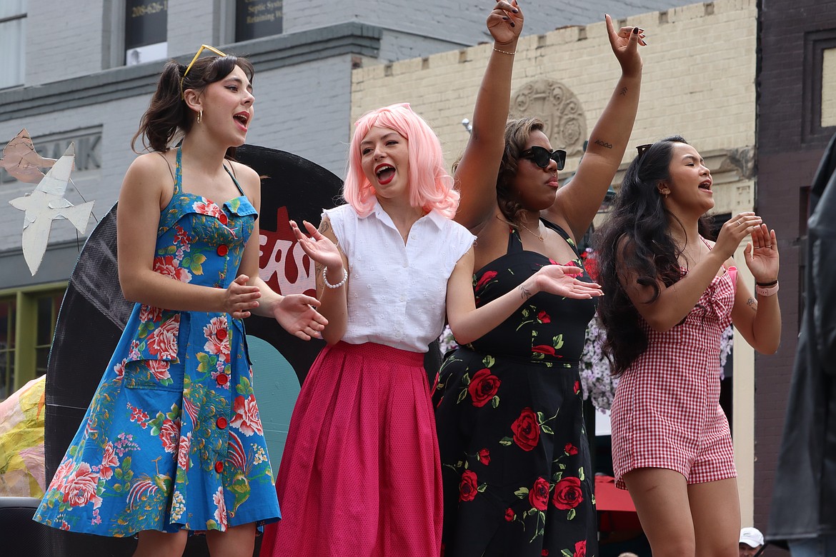 The cast from "Grease" with the Lake City Playhouse has fun in Friday's parade.