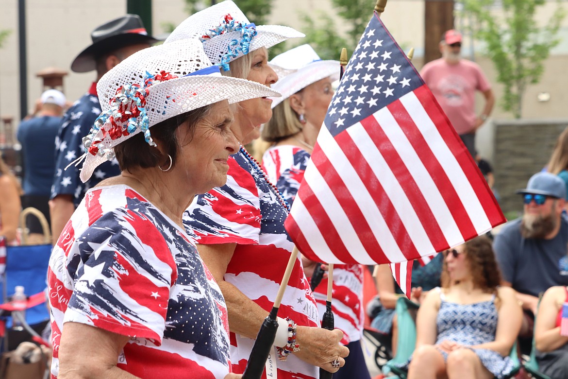 The North Idaho Sparklers smile their way through the Fourth of July parade.