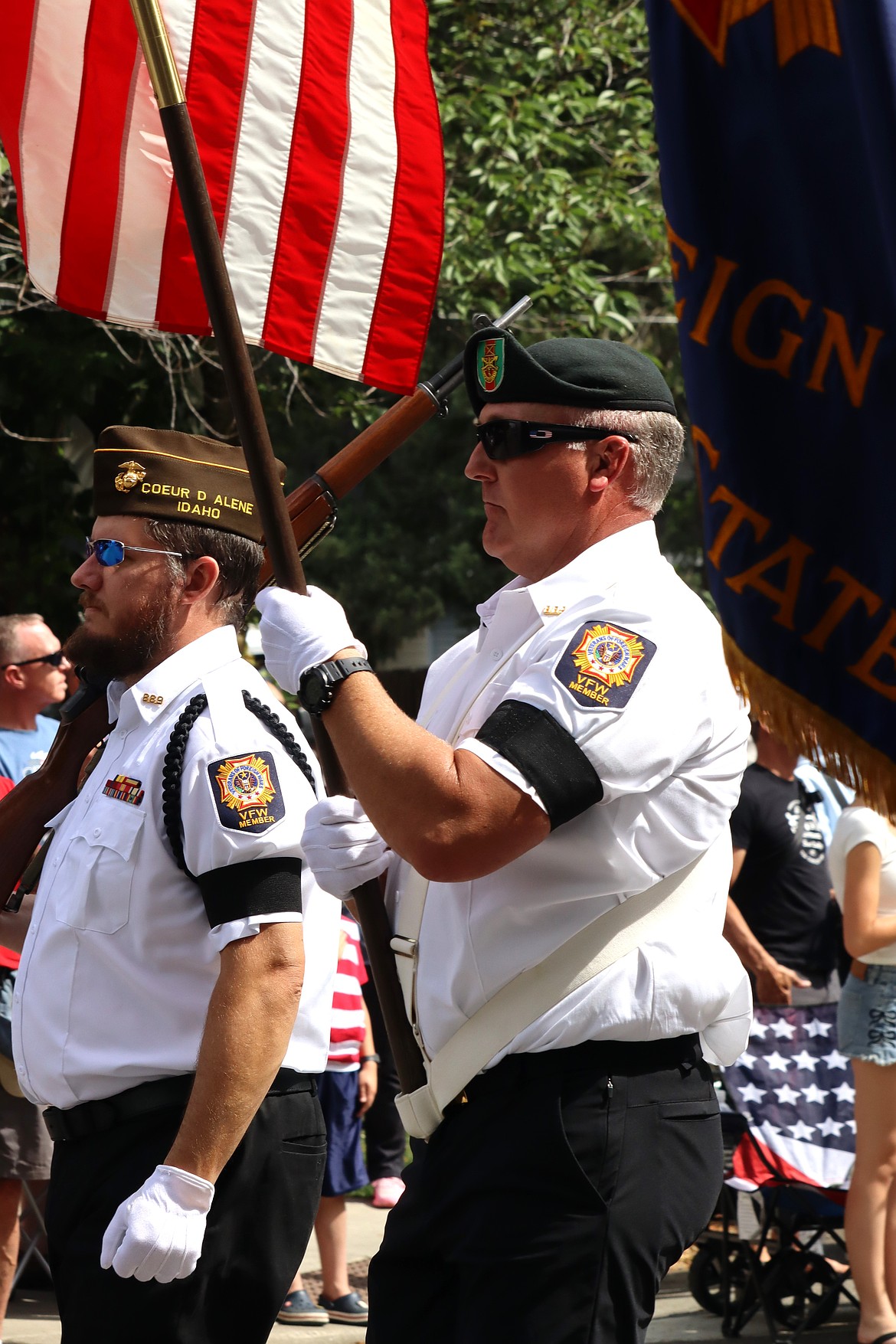 Veterans Jason Legler carries the flag as part of the Honor Guard in the Fourth parade.