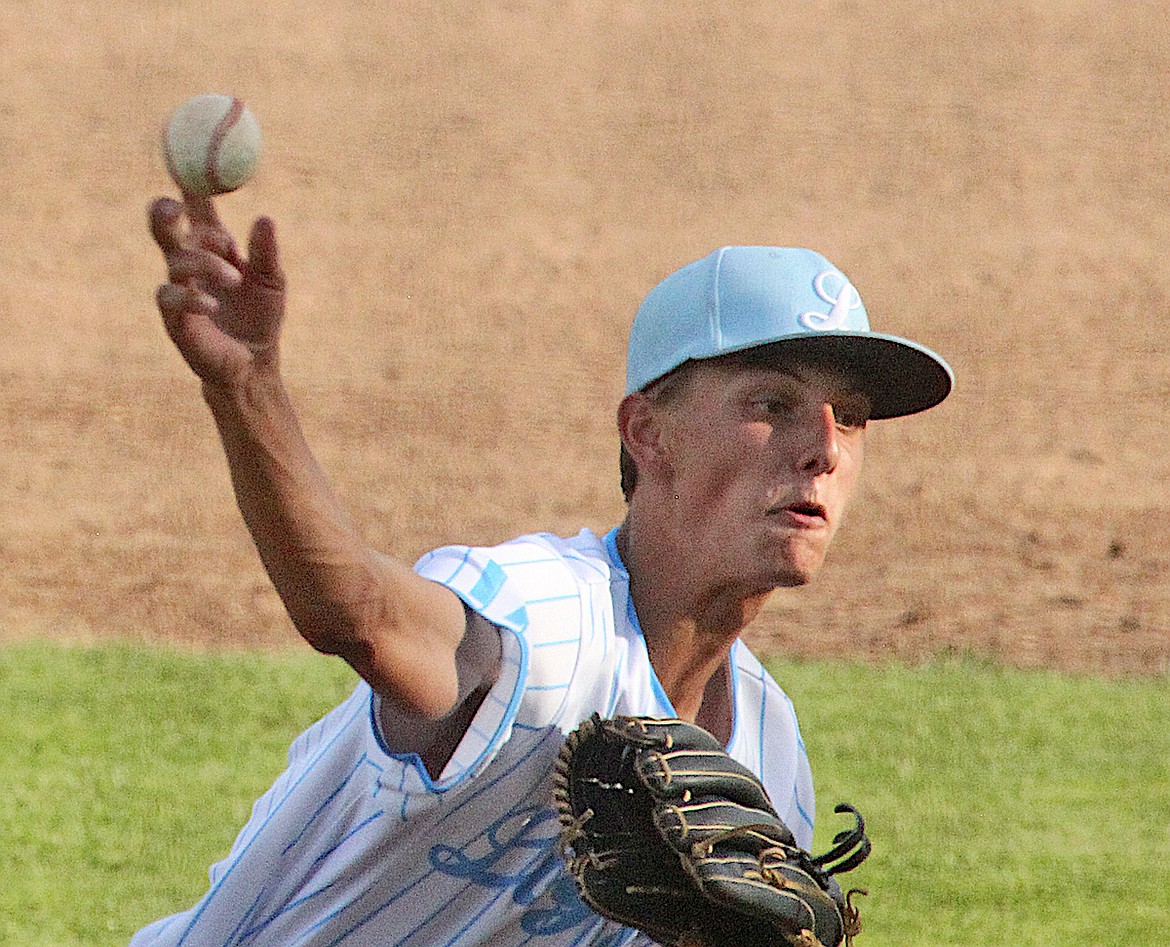 Libby Legion baseball player James Woody delivers the 3-0 pitch to Eureka's Calvin Eisenbarth for strike one in the top of the eighth July 2. The Loggers beat the Rangers, 11-1. (Paul Sievers/The Western News)