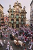 Daredevils run with charging bulls at Pamplona's famous San Fermín festival