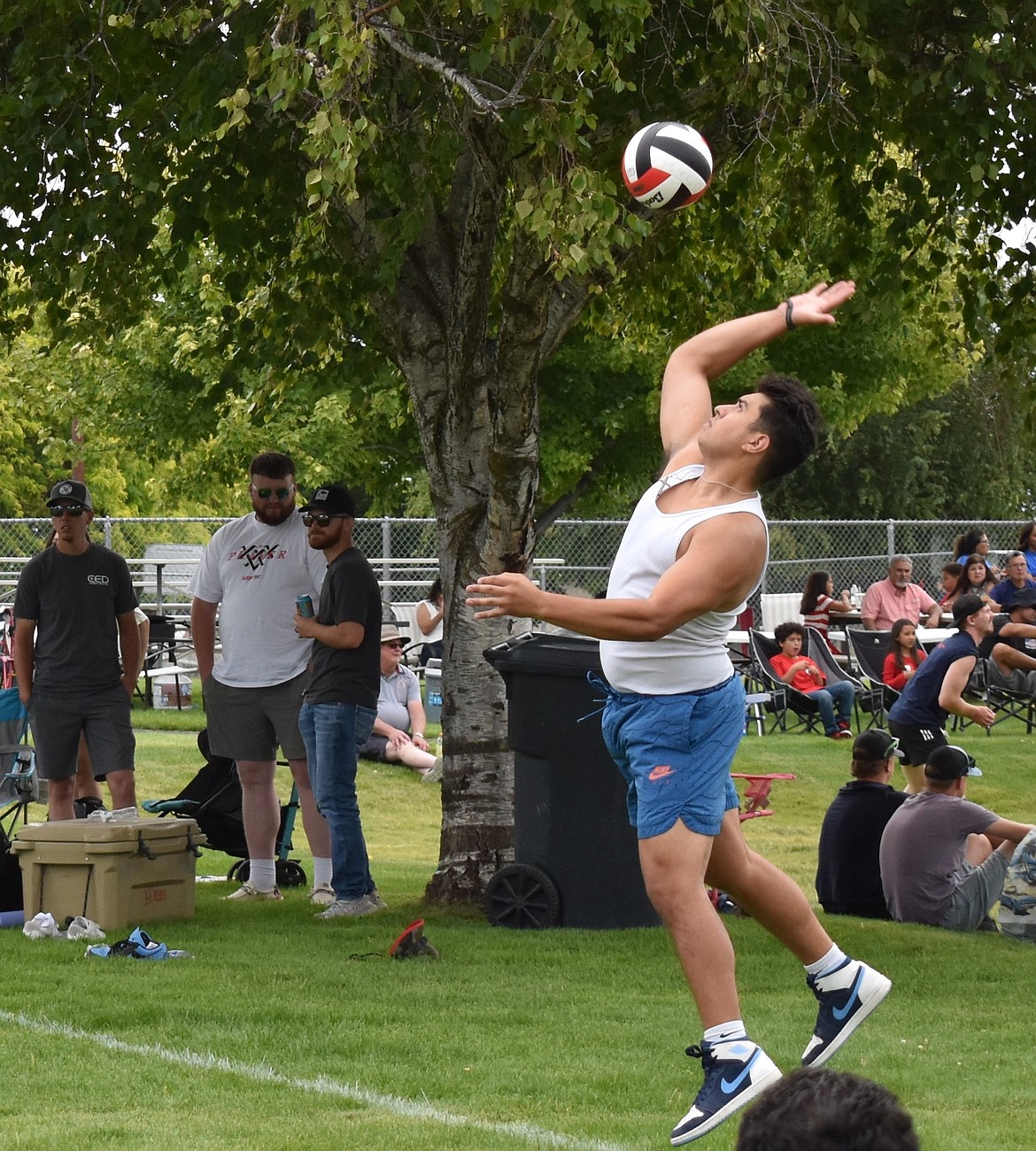 A volleyball player in the tournament serves the ball at Lions Park on July 4. There were tournaments for soccer, basketball and volleyball with volleyball having the highest turnout.