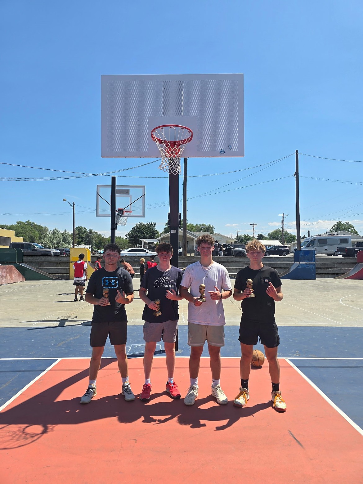 The 16-18 boys team, the Air Ballers, stands together with their trophies after winning in their bracket. This year’s tournament had 20 teams participating compared to last year’s six.