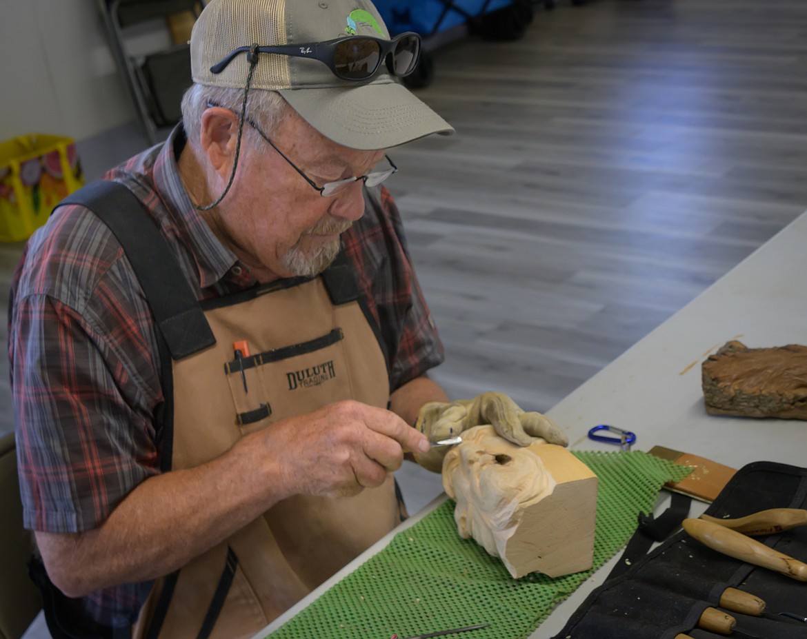 Missoula carver Dexter Vexteraspevig creates a multi-faced bust. (Tracy Scott/Valley Press)
