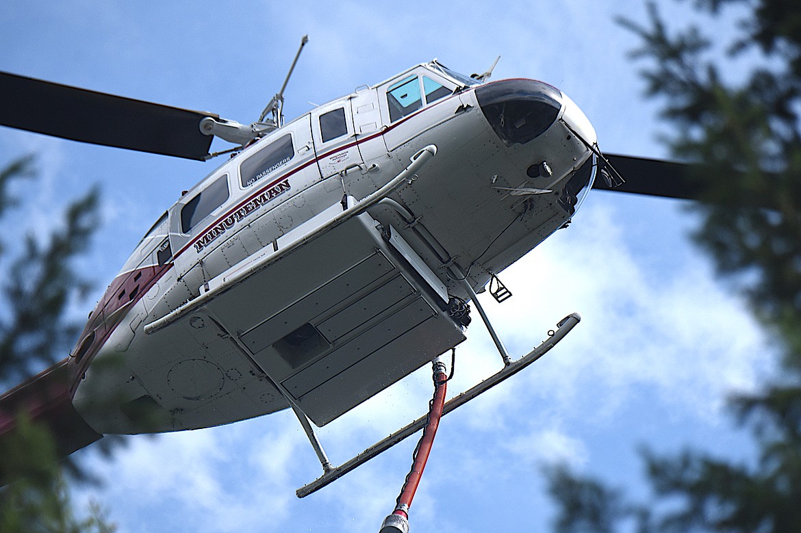 One of two helicopters that dropped water on the Wolf 11 Fire Monday, July 14, 2025. (Scott Shindledecker/The Western News)