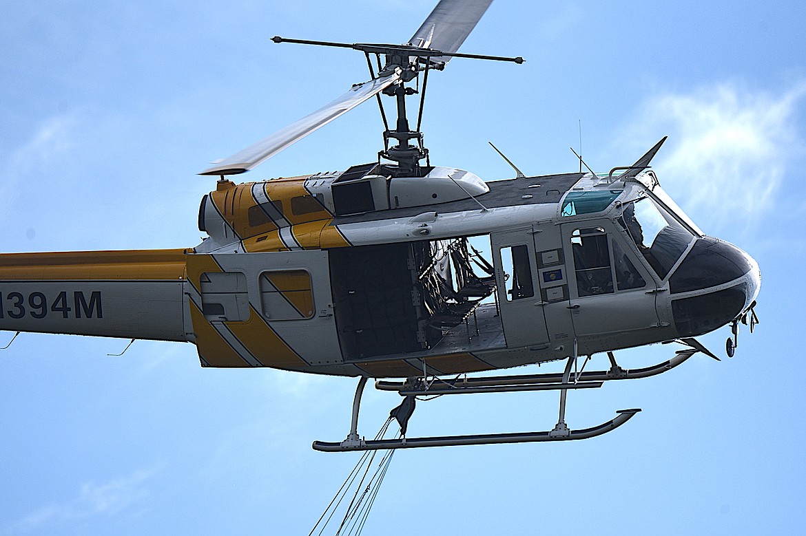 One of two helicopters that dropped water on the Wolf 11 Fire Monday, July 14, 2025. (Scott Shindledecker/The Western News)