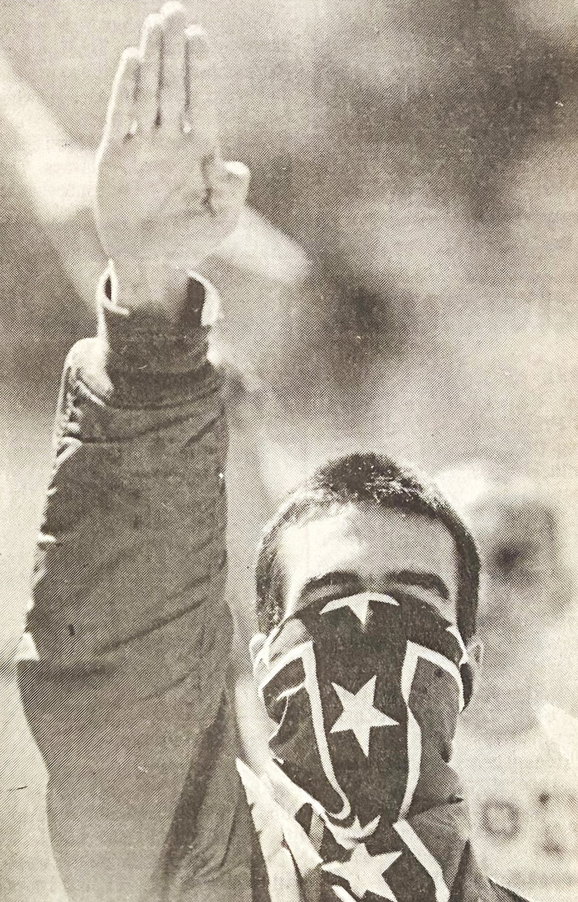 An unidentified neo-Nazi Sieg Heiled at the annual Aryan Nations World Congress in 1990. Violence later bankrupted Richard Butler’s group.