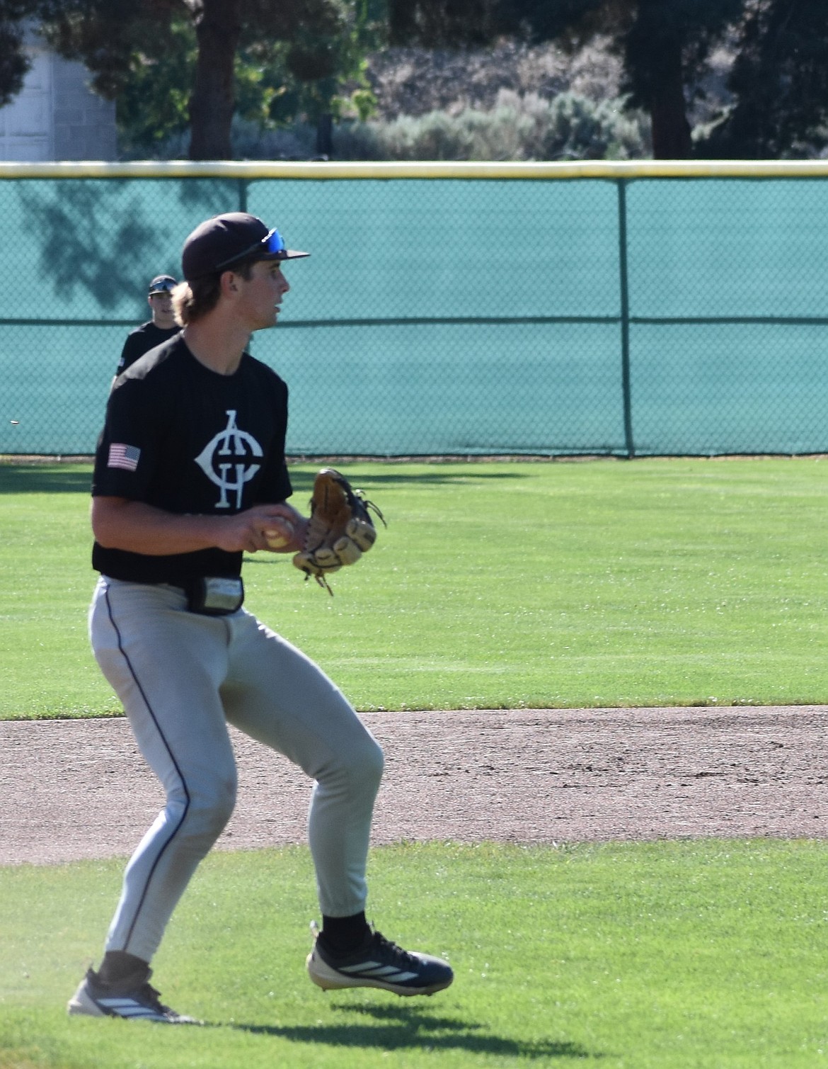 ACH Legion’s Max Grindy prepares to throw the ball to first base for an out. Grindy pitched in game one where he racked up eight strikeouts against Trail AA Orioles 17u.
