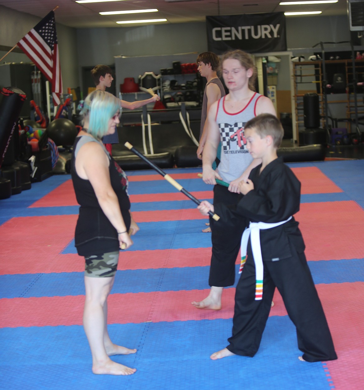 Jacob Guertin, middle, guides students through the weapons movement. Guertin said he taught attendees six different weapons movements during their Wednesday seminar.