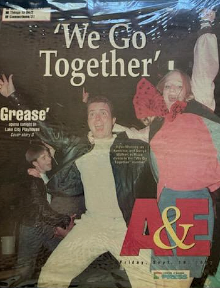 The cover of a September 1997 Coeur d'Alene Press A&E publication highlights a scene from "Grease" at Lake City Playhouse. The beloved show returns to the playhouse tonight after 28 years, directed by Brooke Wood, who was a cast member in the '97 show.