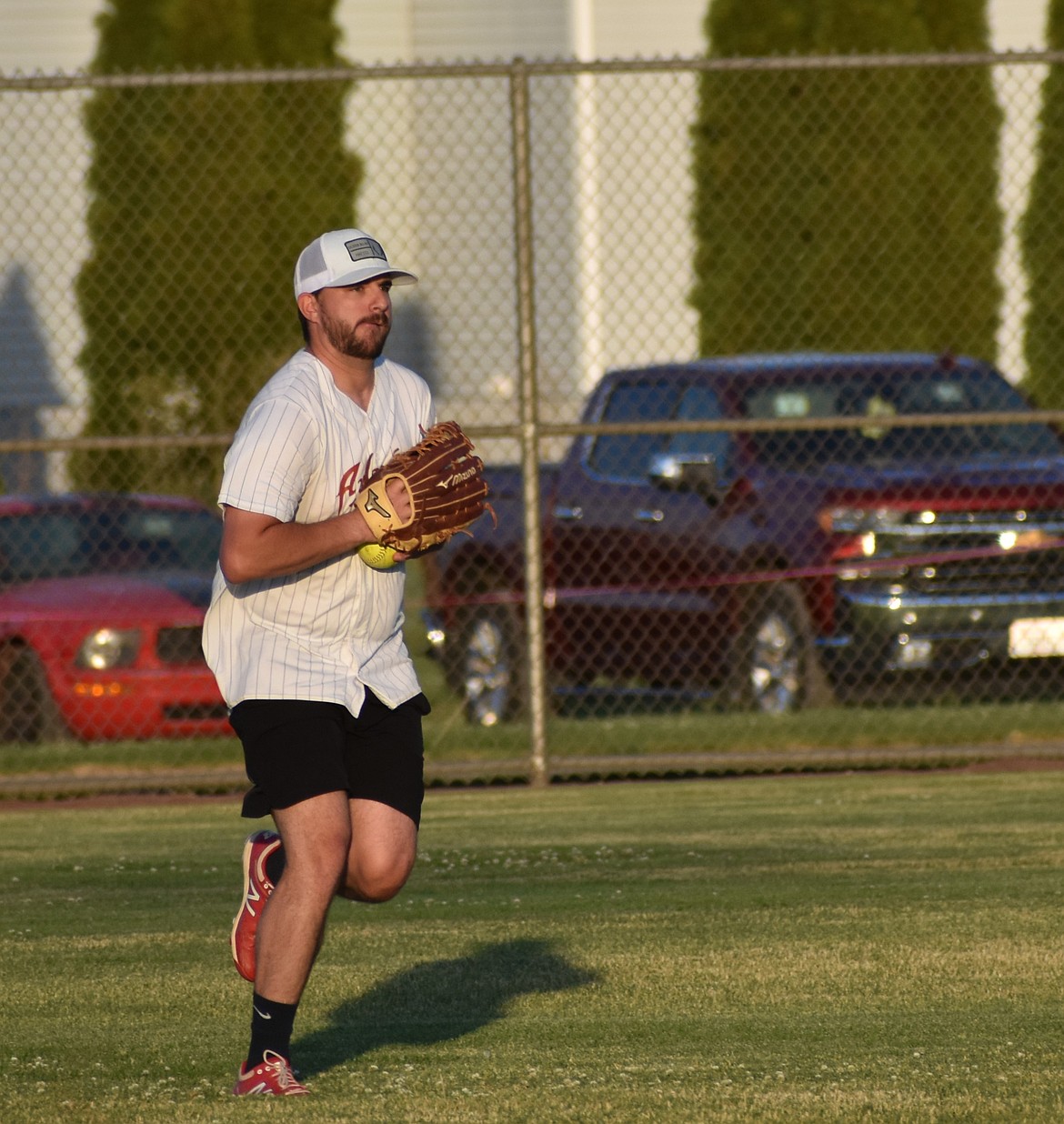 An Average Joes player prepares to throw the ball back toward the diamond during their first game against the OGs. The Average Joes entered as the number two seed in the lower division.