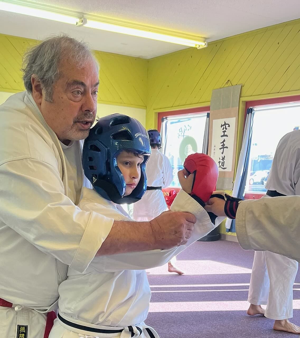 Stone instructs one of his students during one of his classes at the dojo. Stone said he has had to make gradual changes over the last 35 years of teaching karate.