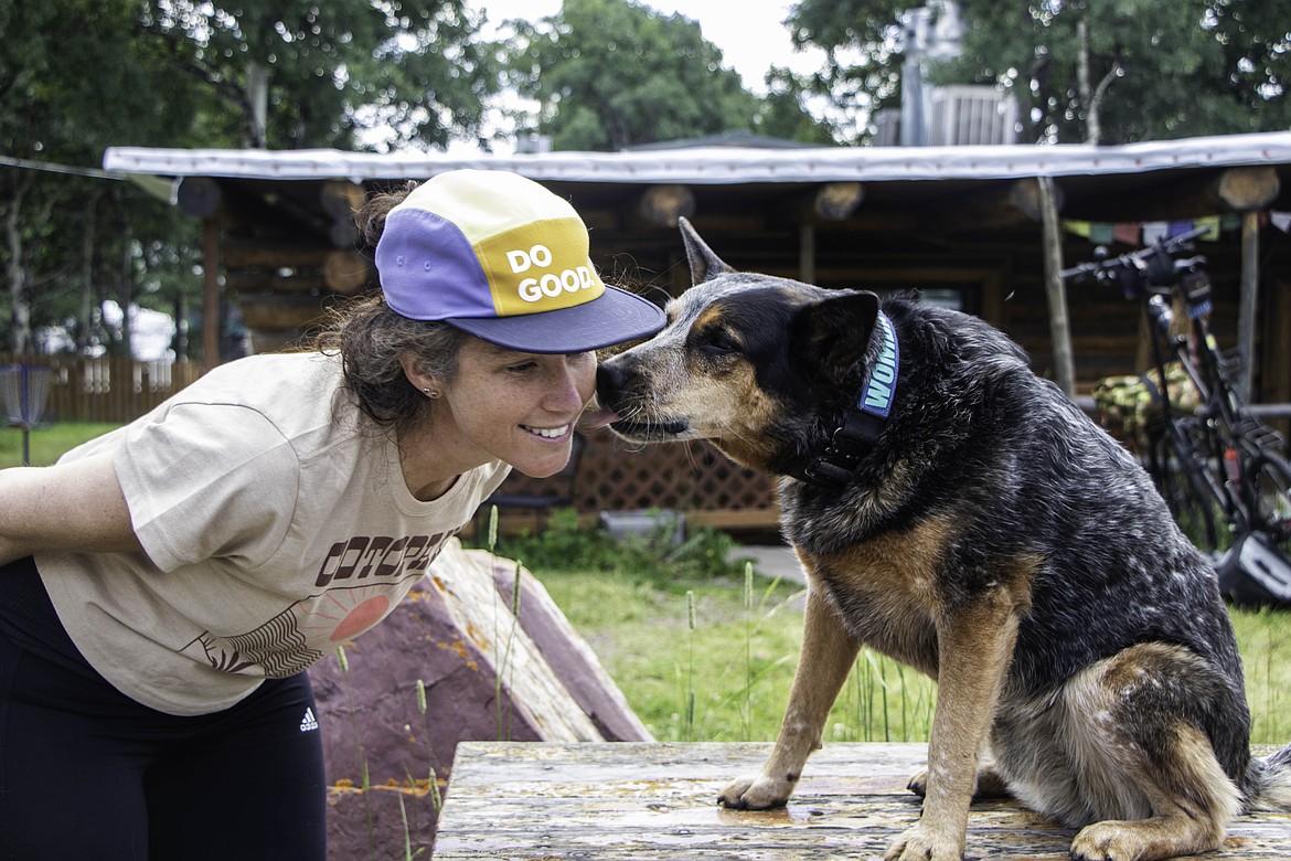 Lucy Barnard, and her dog Wombat, at the Looking Glass Basecamp in East Glacier. (Kate Heston/Daily Inter Lake)