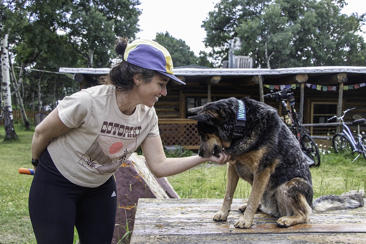 Lucy Barnard, and her dog Wombat, at the Looking Glass Basecamp in East Glacier. (Kate Heston/Daily Inter Lake)