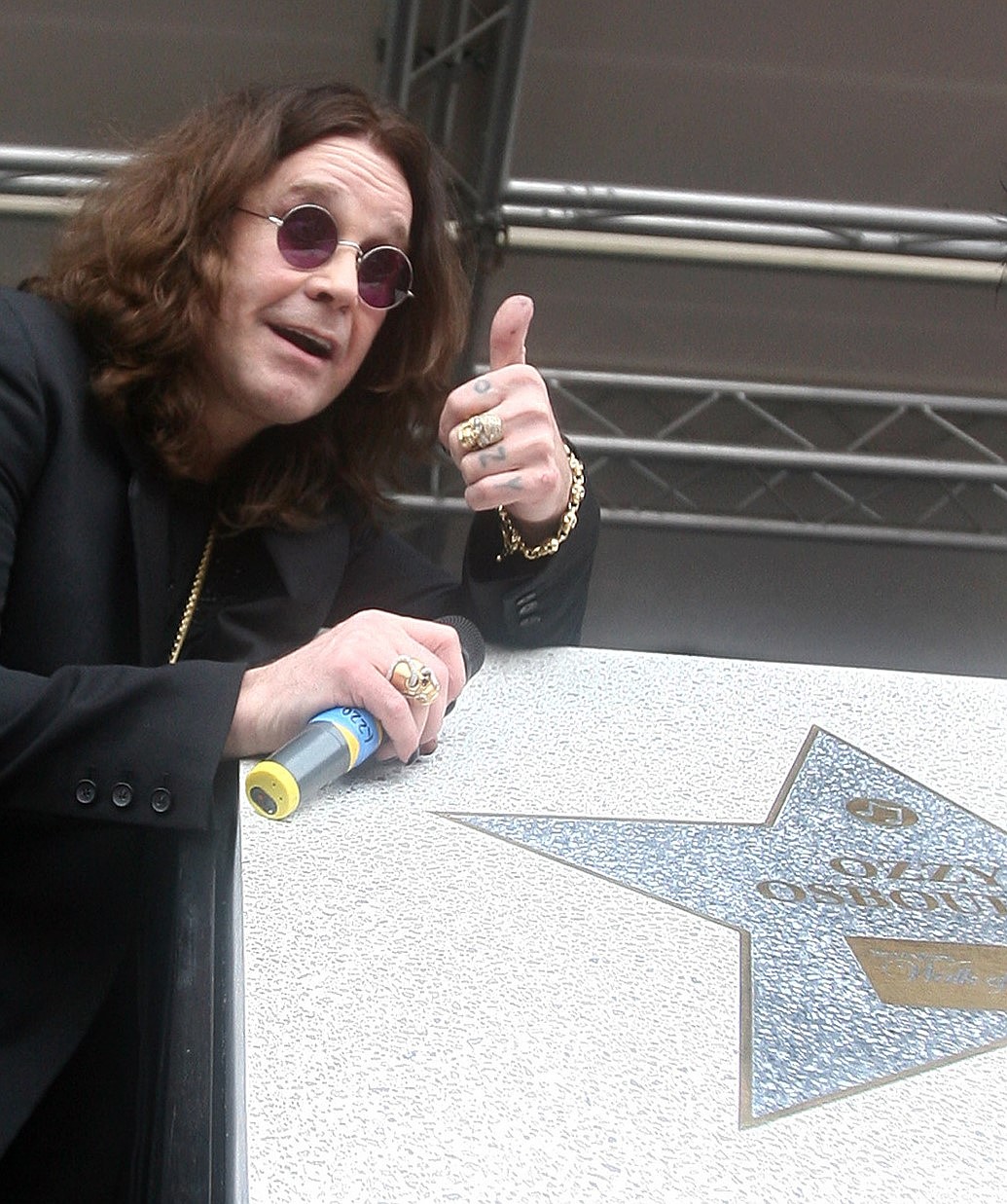 Rock star Ozzy Osbourne reacts to the crowd after becoming the first artist to be honored on Birmingham's Hollywood-style "Walk of Fame" in Birmingham, England, July 6, 2007. The former Black Sabbath singer and reality TV star was born in Aston, Birmingham.