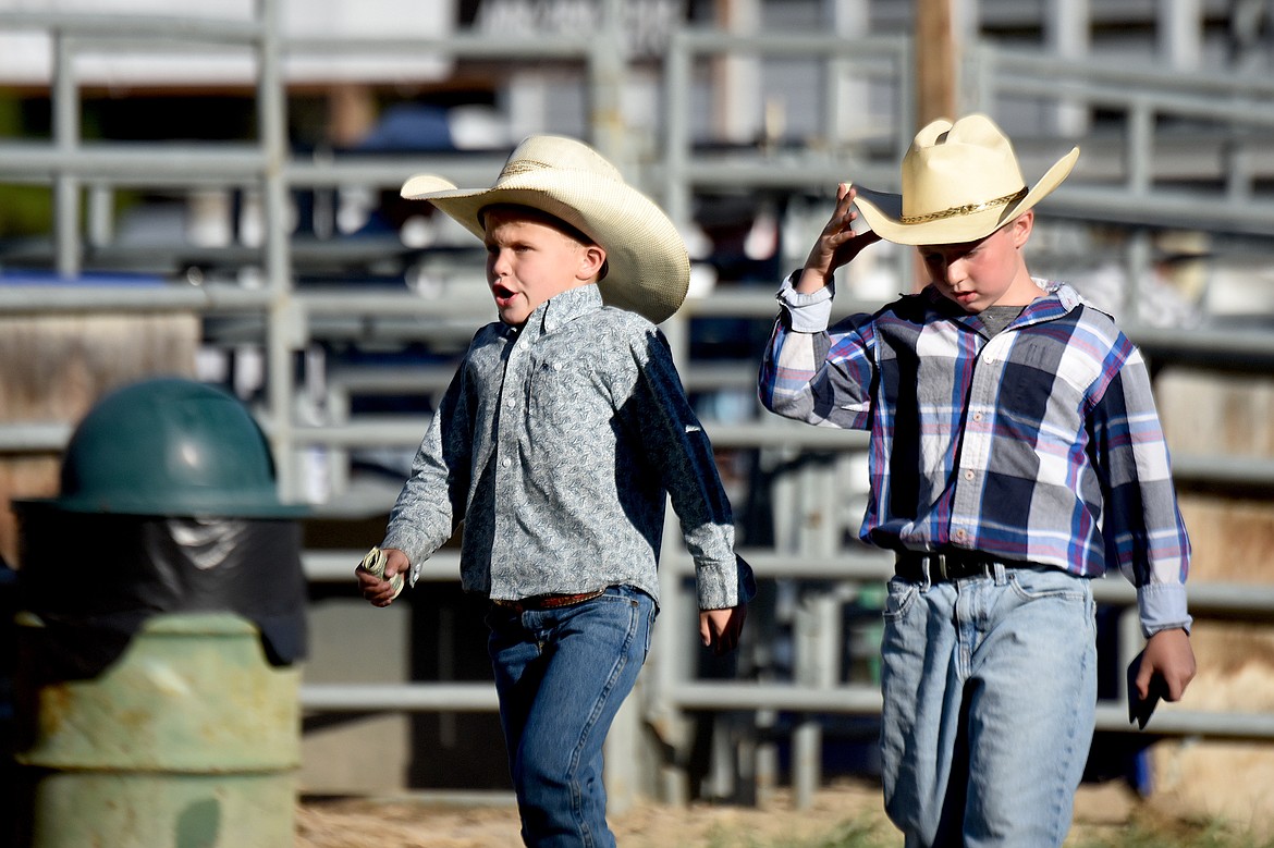 Two young cowpokes get ready for the action Friday, July 25, 2025, at the Kootenai River Stampede in Libby. (Scott Shindledecker/The Western News)
