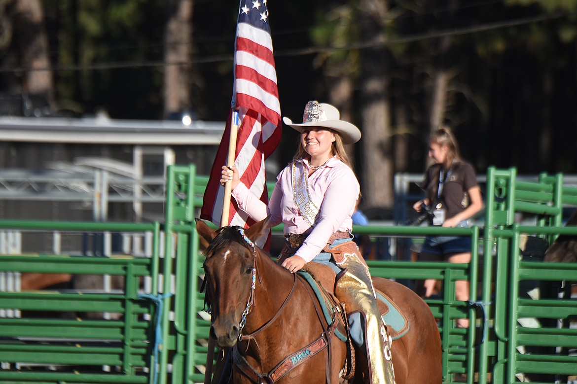 Ravalli County's Loren Loeffler carried the U.S. flag Friday, July 25, 2025, at the Kootenai River Stampede in Libby. (Scott Shindledecker/The Western News)