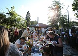 TV show films backyard renovation, community gathers for 95th Monday Night Dinner