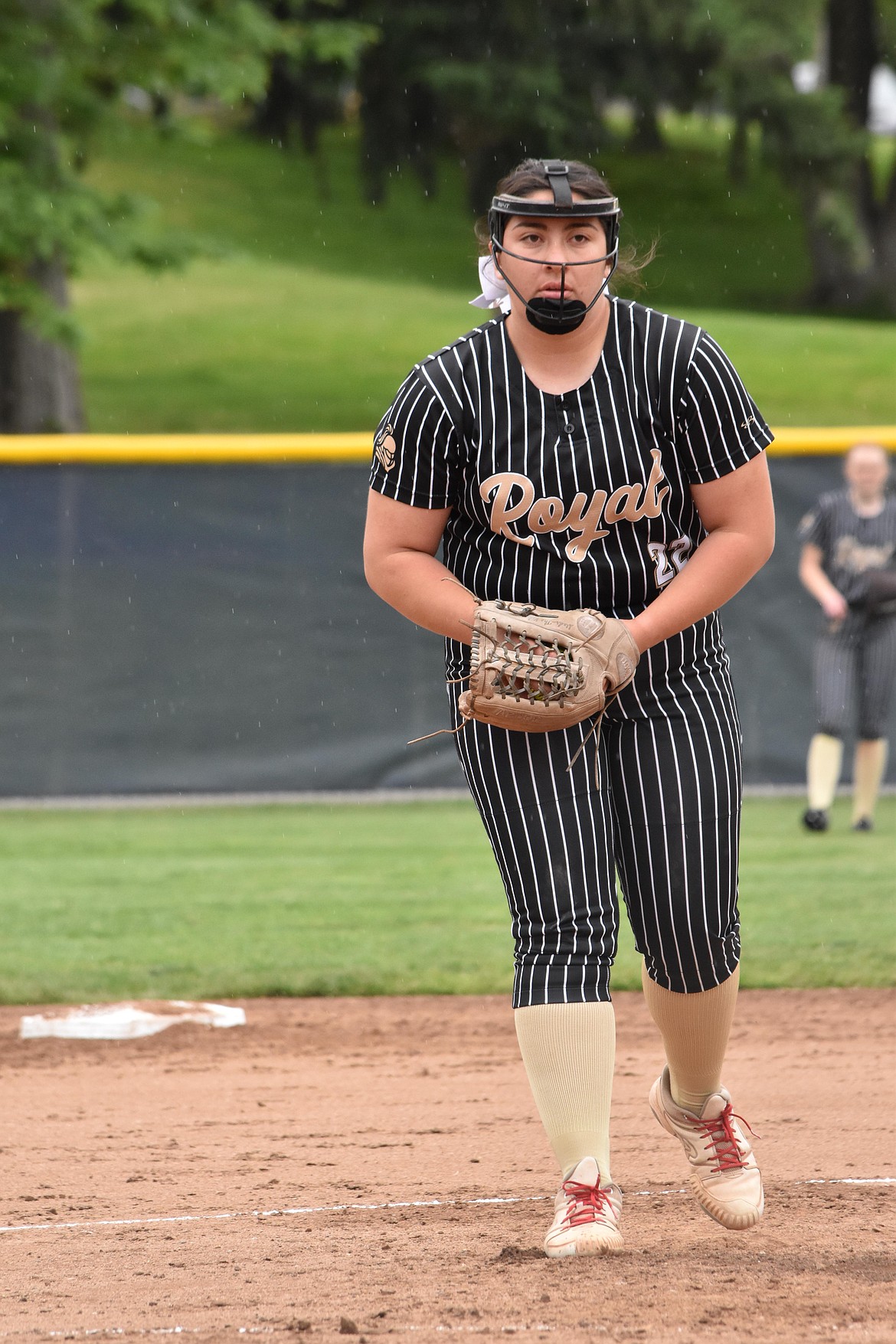 Madison Sanchez, former softball player at Royal High School, prepares to throw a pitch during a game in her junior season. Sanchez said she looked up to her sister Makayla growing up and learned a lot from watching her.