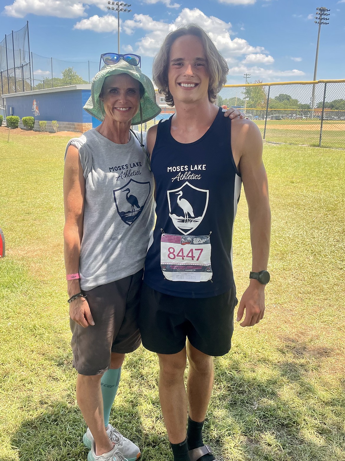 Moses Lake Athletics Club head coach, Jodi O’Shea, left, takes a photo with her son Liam, right, at the USA Track and Field Nationals meet. Jodi said this is the second year of the club and is proud of how far they have come.