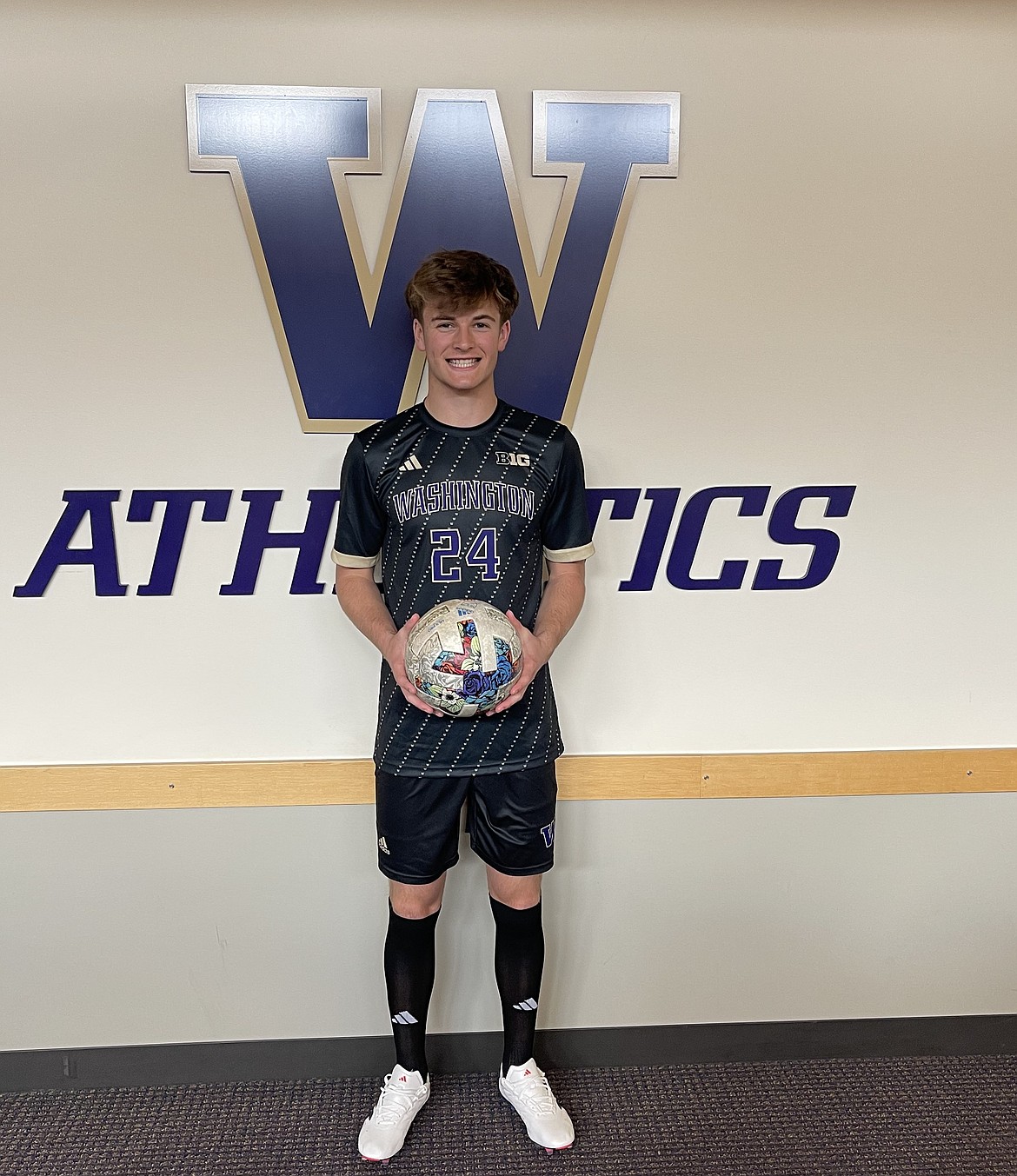 Anderson Brown, a University of Washington commit, at a recent visit to the Huskies athletics facility. Brown said the coaching staff's efforts to establish a personable relationship with him and his family helped him decide to commit.