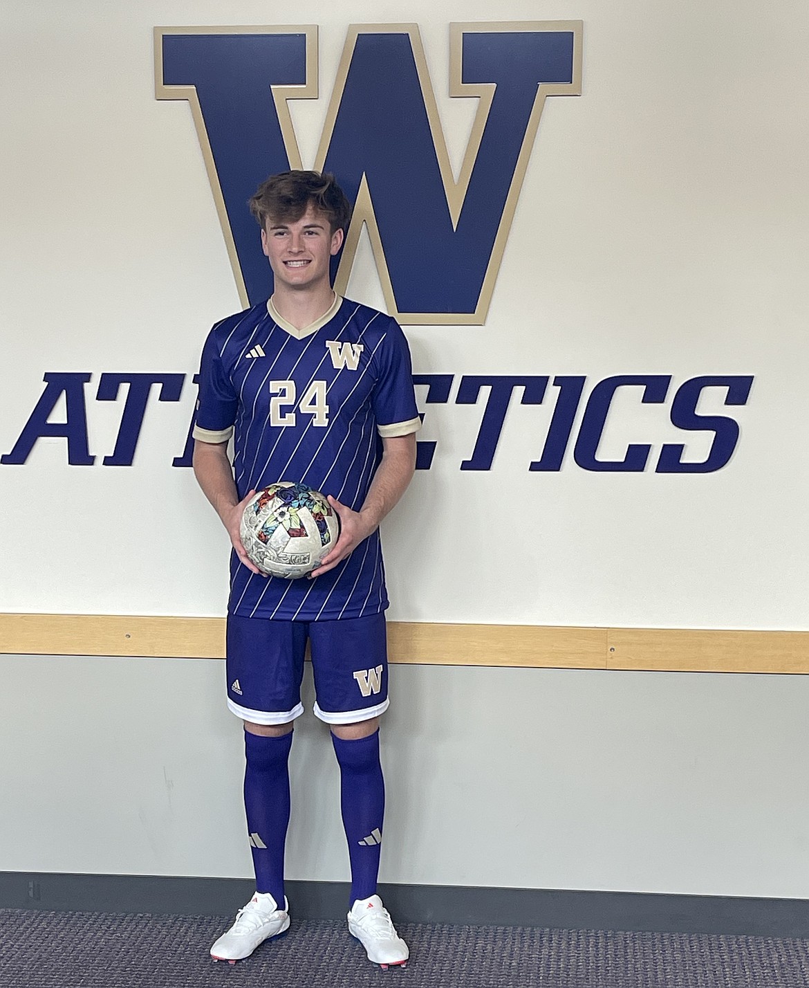 Huskie commit, Anderson Brown, in uniform on a visit to the University of Washington. Brown said his versatility and dedication to the sport helped him stand out in the recruiting process.