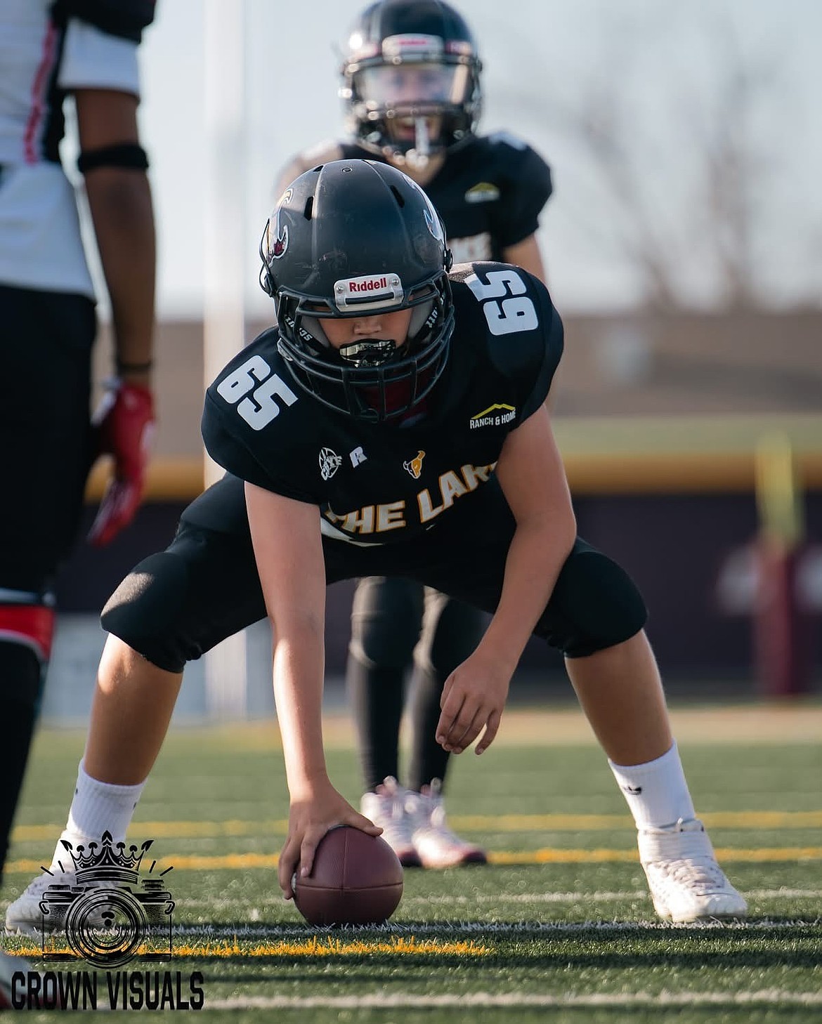 The center for one of the Moses Lake Jr. Mavs teams readies to hike the ball in a game last season. The Jr Mavs program works alongside the Moses Lake High School varsity program to prepare the athletes for when they reach the high school level.