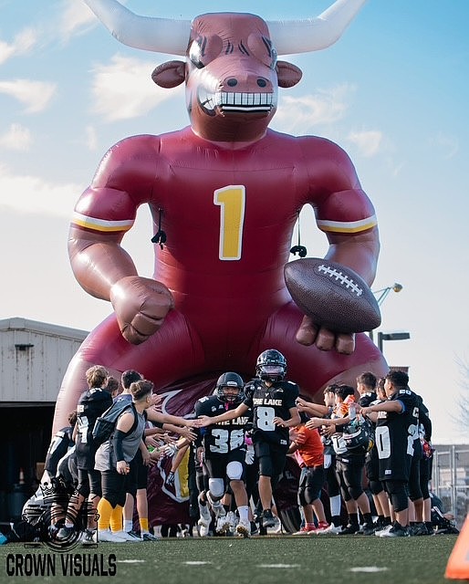 Jr Mavs players run out onto the field at the start of one of their games from last season. The program started in 2023 when Tyson Olson was approached by parents and former players looking for further youth football programs.