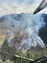 Cool weather slows fire's growth