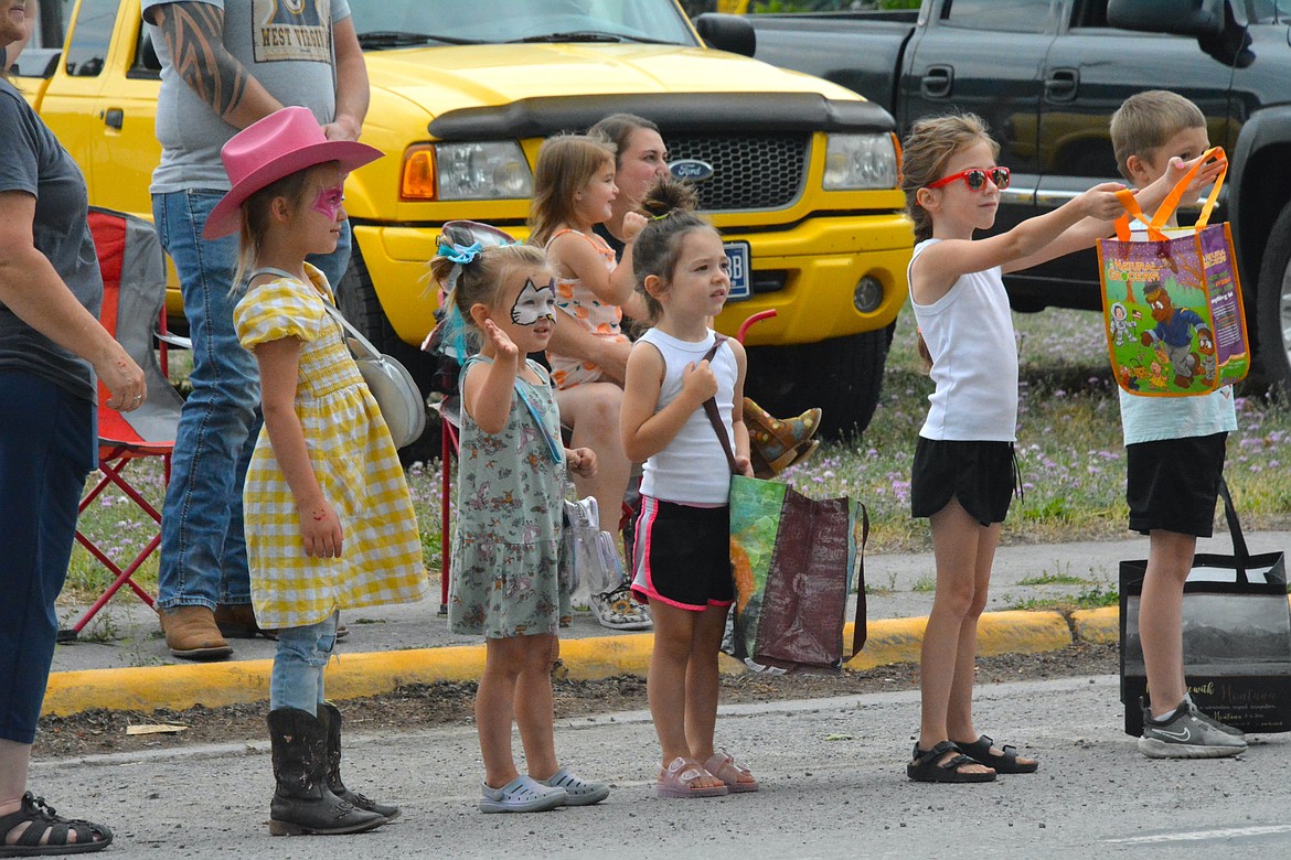 Children packed the streets, filling bags with candy from the parade on Saturday morning. (Mineral Independent/Amy Quinlivan)