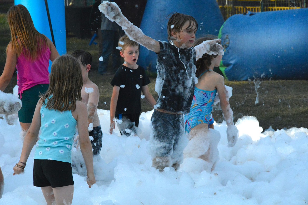 Kids enjoyed a bubble blaster zone, bungee trampolines, paintball, a petting zoo, and a blow-up waterslide during the fair weekend. (Mineral Independent/Amy Quinlivan)